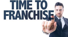 Business man pointing the text: Time to Franchise Business man pointing the text: Time to Franchise